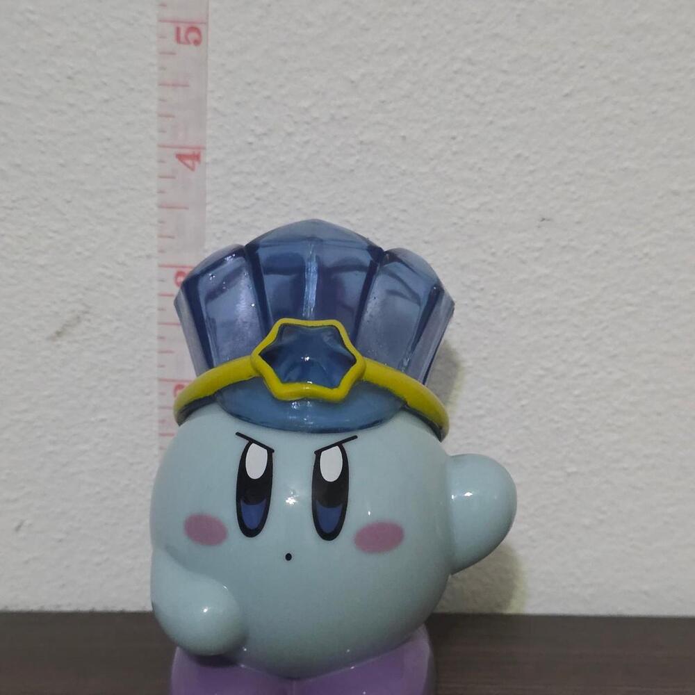 Kirby figure with blue hat and yellow band #gaming #nintendo